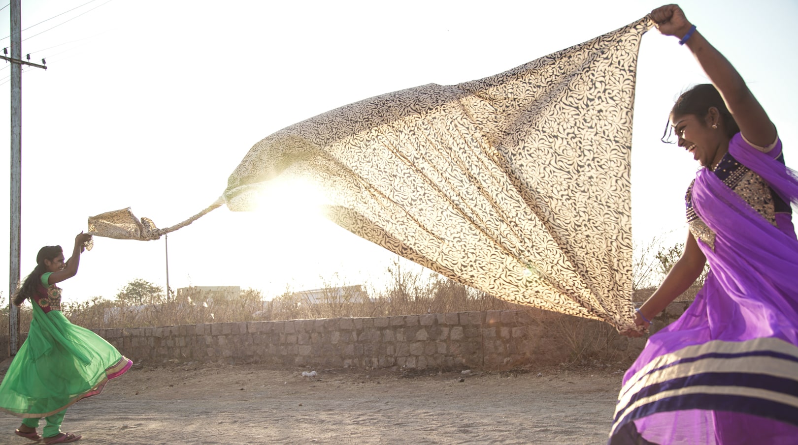 Women dancing with fabric