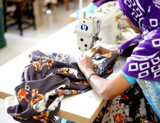 Woman sewing Sudara clothing