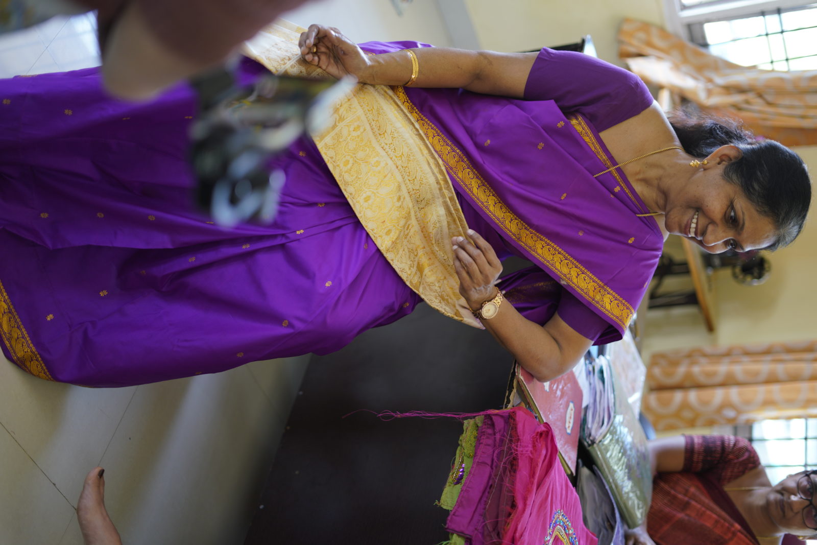 Indian woman in purple Sudara Partners