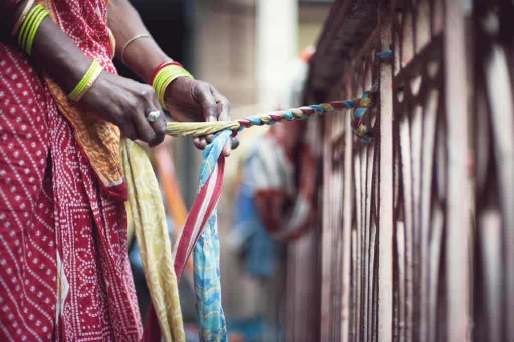 Indian woman braiding material