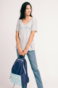 Woman holding Soular backpack